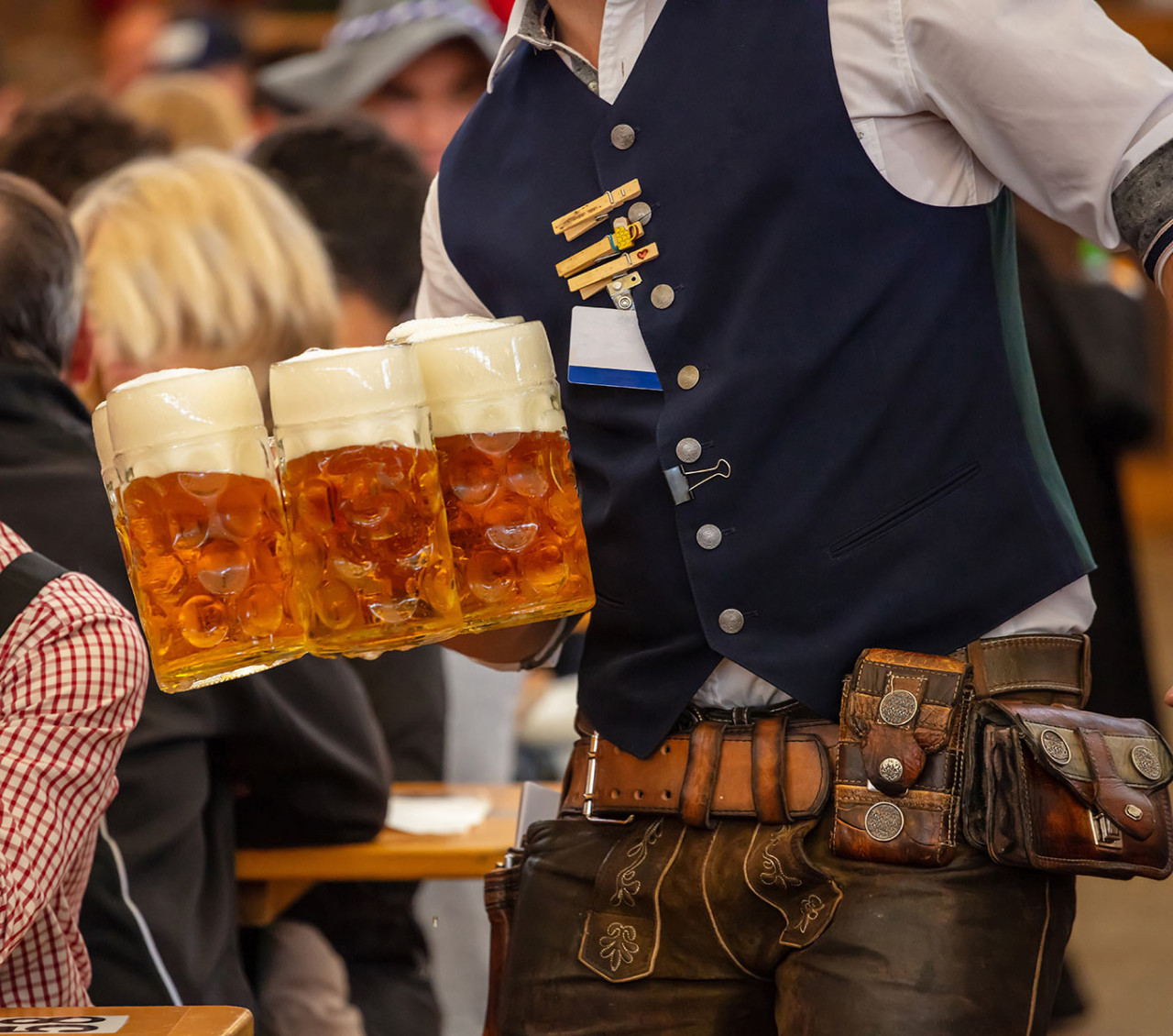 oktoberfest-munich-germany-waiter-serving-beers-closeup-view
